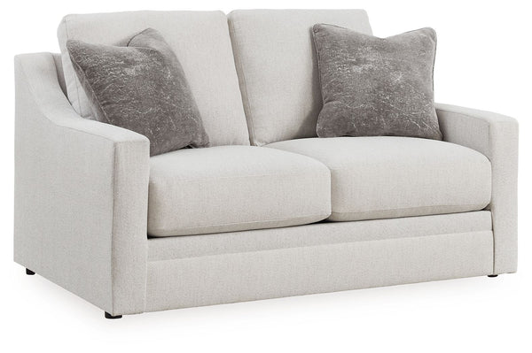 Clean lines and a streamlined silhouette define the architectural attitude of this loveseat. Textured accent pillows in complementary colors add subtle contrast. The loveseat-'s plush reversible cushions beckon you to sit down, get comfy and relax complet