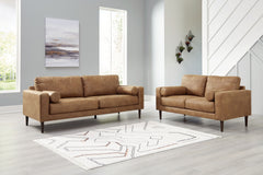 Small-scale style, tailored to perfection. This set echoes retro aesthetics with warm caramel faux leather, while its ultra-linear silhouette incorporates a contemporary edge. Versatile in form and function, the seat suits styles from modern boho to trans