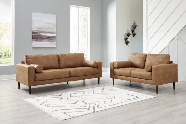 Small-scale style, tailored to perfection. This set echoes retro aesthetics with warm caramel faux leather, while its ultra-linear silhouette incorporates a contemporary edge. Versatile in form and function, the seat suits styles from modern boho to trans
