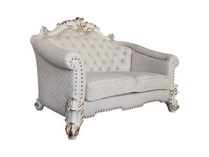 Tracing back to the classical Baroque era, expressed with intent and conviction, our new interpretation of Vendome II is donned. The Vendome II sofa-'s light gray fabric is grand and classy with crystal like button tufting on the back in a crackled gold p