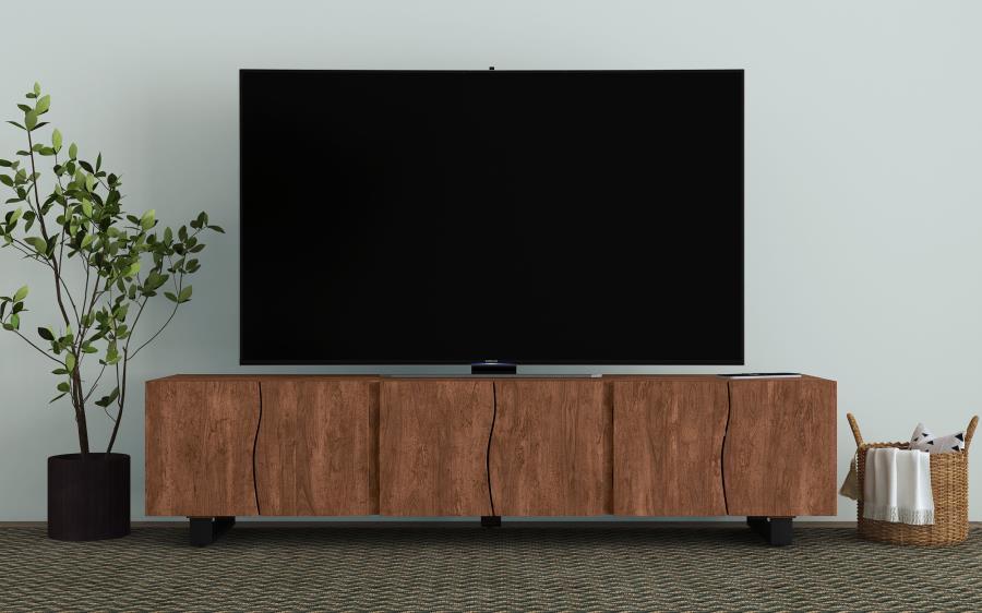 This spacious TV stand is crafted from solid mango wood, offering ample storage with its four doors and adjustable shelves. The mango brown finish highlights the natural beauty of the wood grain, giving it a warm and timeless look. Curved panel details on