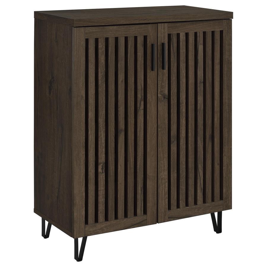 Transform your foyer or hallway with this versatile shoe cabinet, designed to keep your footwear organized and out of sight while complementing a variety of interior styles. Behind its distinctive vertical-slatted doors, multiple adjustable shelves provid
