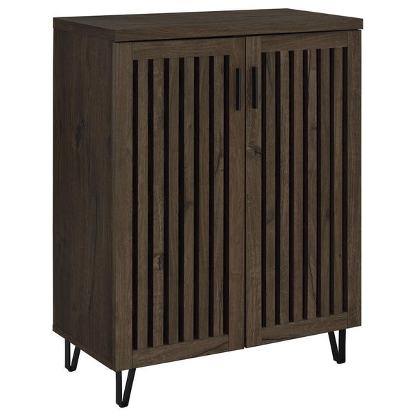 Transform your foyer or hallway with this versatile shoe cabinet, designed to keep your footwear organized and out of sight while complementing a variety of interior styles. Behind its distinctive vertical-slatted doors, multiple adjustable shelves provid