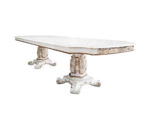 Commanding attention in any space, the impressive design of the Vendom double pedestal dining table will impress everyone. Adorned with classic elements including scrolls, curved shapes, and leaf molding accents to create an old-world charm. The antique p
