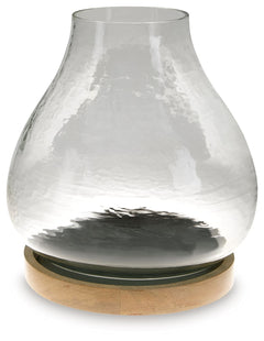 The warbled texture of this glass candle holder gives it a casual, rustic charm. Add a pillar candle in the color of your choice, or use a white candle for that classic look. The hurricane candle holder creates a lovely ambiance when placed on a dining ta