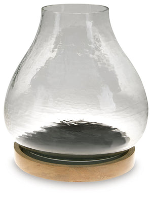 The warbled texture of this glass candle holder gives it a casual, rustic charm. Add a pillar candle in the color of your choice, or use a white candle for that classic look. The hurricane candle holder creates a lovely ambiance when placed on a dining ta