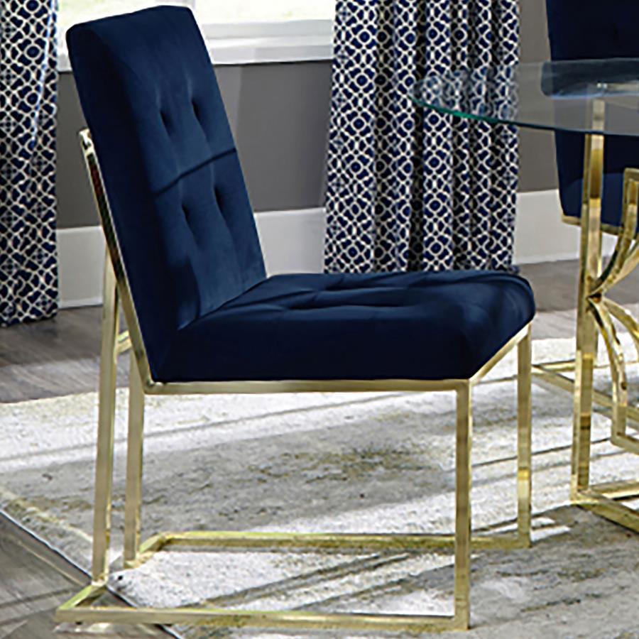 Bold color and radiant metallic from this armless dining chair create a stunning visual. Arranged elegantly, sleek and metallic gold legs create an open feel. Plush blue cushions fill the seat and back, elevated with button tufts. Bold colors and angles m