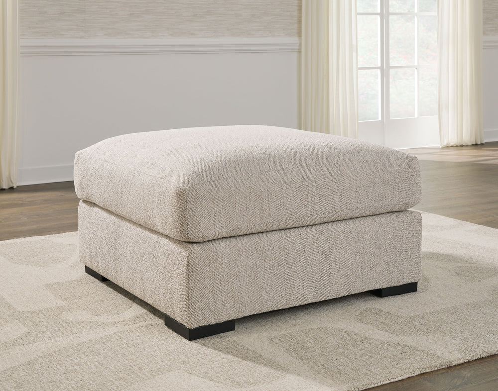 Reminiscent of a fine, subtly patterned herringbone jacket, this casually elegant ottoman offers contemporary style in spades. Its oversized silhouette provides plenty of leg room, while a soft feather-blend top cushion maximizes relaxation. Why skimp on 