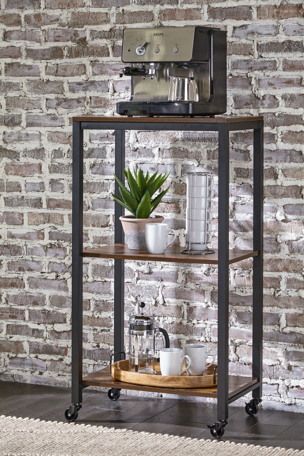 Impress your party guests in style with this bar cart. It features a sturdy design, with black metal rails and an antiqued brown wood finish on the three shelves for a relaxed feel. Smooth-gliding casters offer easy mobility.<br><br><b>Additional Dimensio