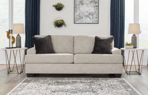  the clean-lined piece is outfitted with angular arms for a layer of geometric expression. Softly upholstered