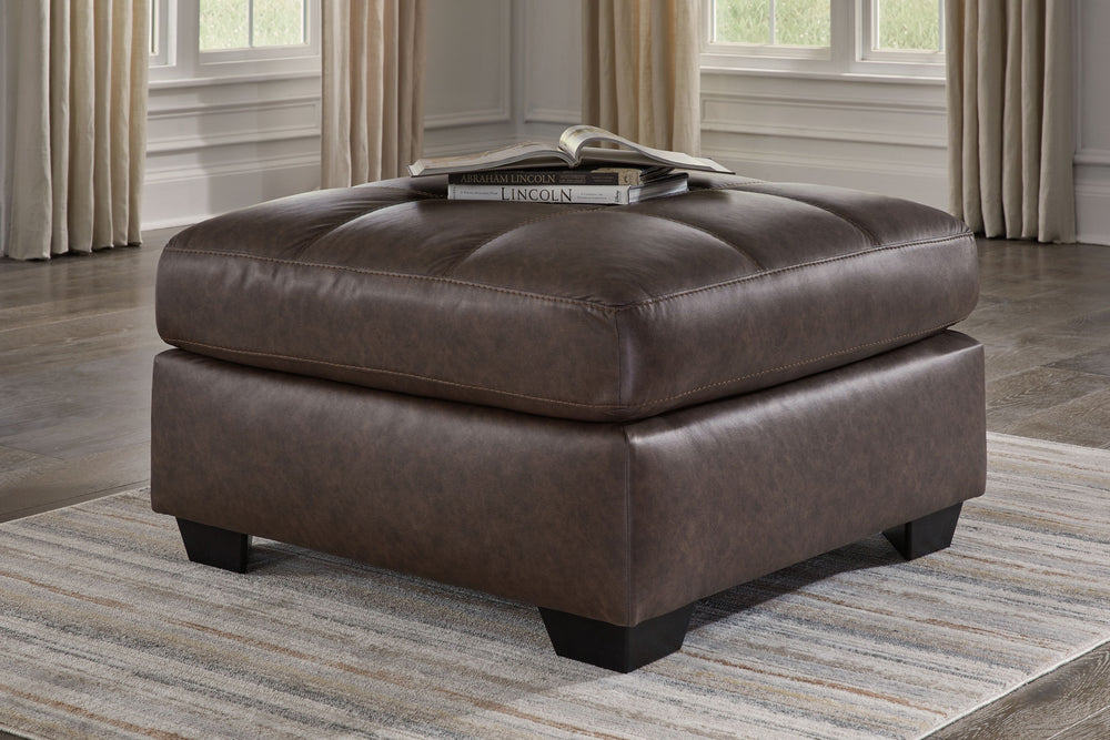 Everyday comfort meets versatile style in this oversized ottoman. The handsome hue of the goes-with-anything faux leather takes away the stress of styling, expertly pairing with your existing aesthetic. From kicking back on the weekends to relaxing post-w