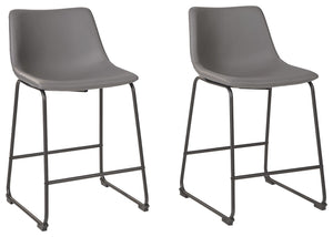 With its distinctive contoured bucket seat and tubular metal base, this bar stool serves up a fresh twist on mid-century inspired style. Chic gray faux leather upholstery adds to the aesthetic. What a timeless look for eat-in kitchens and casually cool di