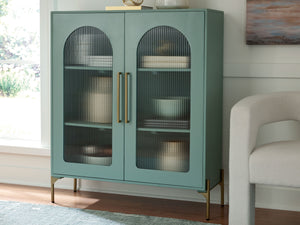  this sleek accent cabinet wows on many levels. Magnificent arched fluted glass door panels and goldtone metal hardware exude serious modern flair. And how about that fresh green finish?