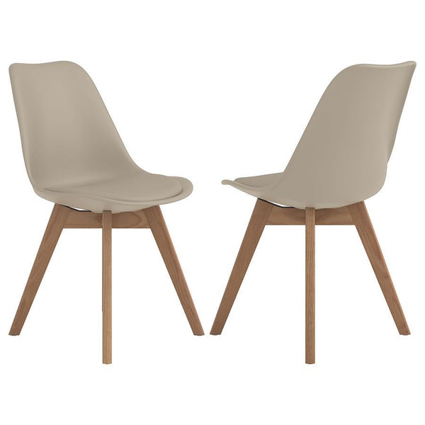 Add a touch of mid-century charm to your dining space with this tan side chair. The smooth faux leather seat and angled oak wood legs create a warm, modern aesthetic. Designed with durability and comfort in mind, it features a padded seat and a resilient 