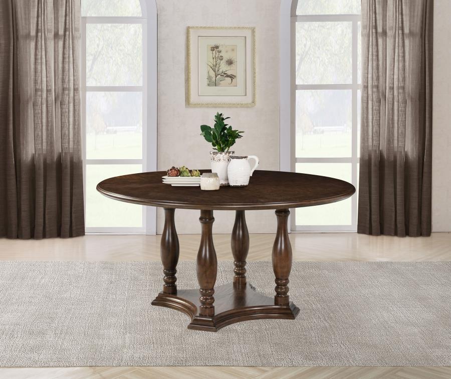 Upgrade your kitchen or dining room with the classic design of a round wood dining table. Crafted with oak veneer in a rich brown finish, it imparts elegance with subtle trim details and its depth of color. The table boasts a decorative base design with a