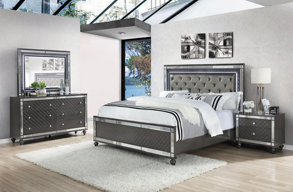 Elevate your sanctuary with this dazzling bedroom collection, where contemporary chic meets timeless charm. The suite boasts a stunning graphite finish, imbuing your space with an air of sophistication and modern luxury. At the heart lies a plush, tufted 