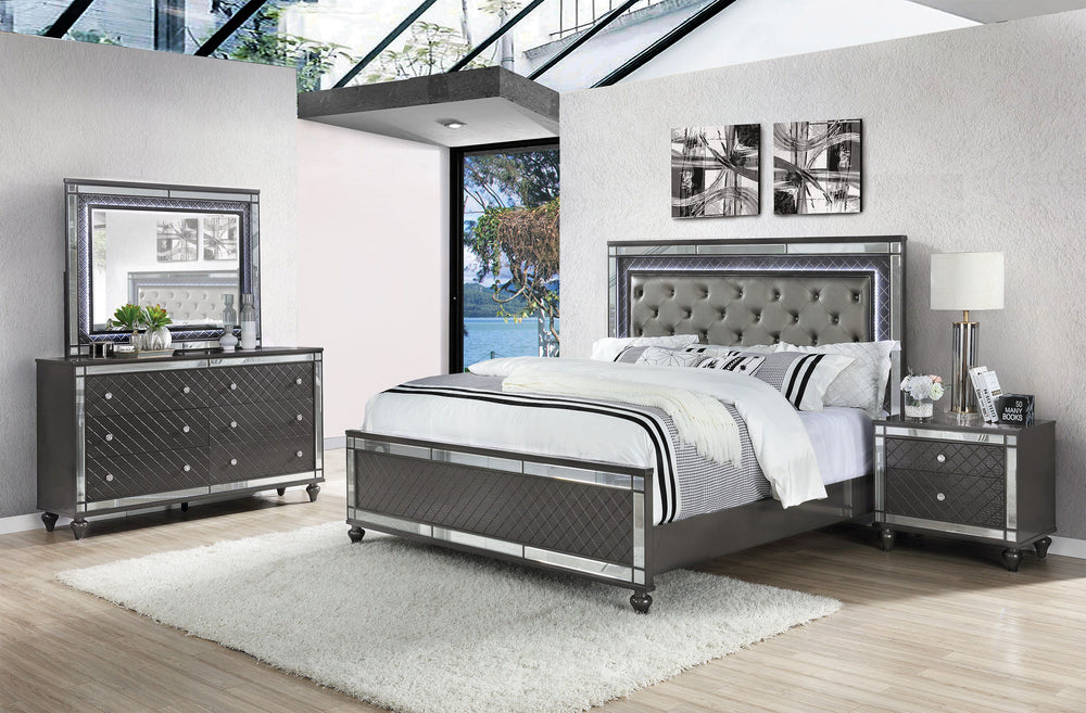 Elevate your sanctuary with this dazzling bedroom collection, where contemporary chic meets timeless charm. The suite boasts a stunning graphite finish, imbuing your space with an air of sophistication and modern luxury. At the heart lies a plush, tufted 