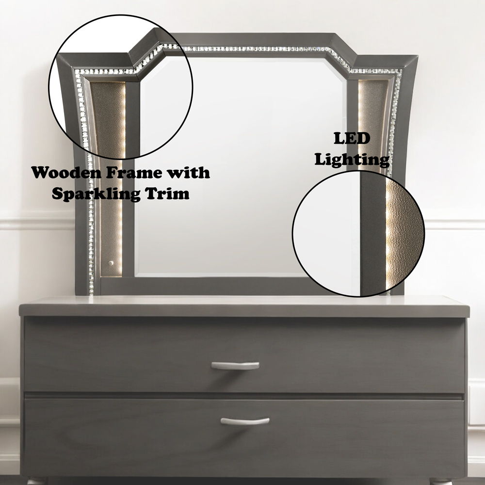 The Kaitlyn mirror provides a commanding presence in any room. Crafted with a transitional look that is an ideal addition to any bedroom, the mirror is accented with LED light and a crystal-like sparkling trim. Its crystal-like trimming creates dazzling g