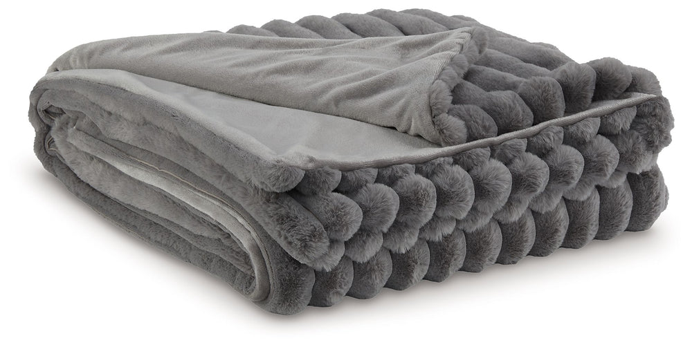 As cozy as they come, this faux fur throw turns your seating area into a haven of comfort. Its neutral hue acts as the perfect foundation for layering, whether mixed with pillows or draped over the arm of a sofa. And itâ€™s machine washable, so you can sp