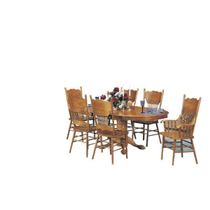 Bring the perfect centerpiece with the Nostalgia Dining Table w/ pedestal . This round table features a pedestal base with long claw feet and a turned leg. The apron comes carved with elegant scrolled details. Durable wood constructs the frame, topped by 