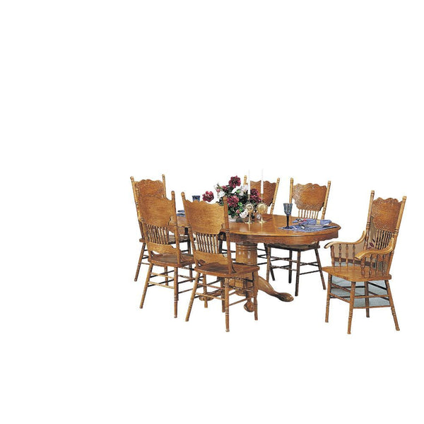 Bring the perfect centerpiece with the Nostalgia Dining Table w/ pedestal . This round table features a pedestal base with long claw feet and a turned leg. The apron comes carved with elegant scrolled details. Durable wood constructs the frame, topped by 