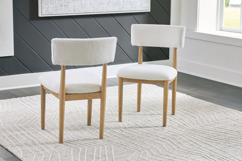Clean lines meet cool curves with this dining chair. Simple round post legs and a natural finish lend a modern vibe, while softly textured upholstery tempts you to sit and stay awhile. What a delicious choice for a dining room update.<br><br><b>Additional
