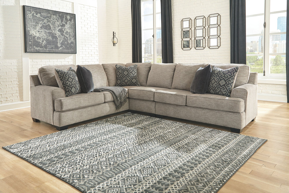 Whether your vision is clean and contemporary or cozy modern farmhouse, this sectional in a stone-tone neutral upholstery has the corner on style. Merging ultimate comfort with striking good looks, this chic sectional includes five coordinating accent pil