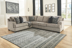 Whether your vision is clean and contemporary or cozy modern farmhouse, this sectional in a stone-tone neutral upholstery has the corner on style. Merging ultimate comfort with striking good looks, this chic sectional includes five coordinating accent pil