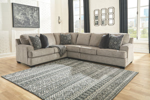 Whether your vision is clean and contemporary or cozy modern farmhouse, this sectional in a stone-tone neutral upholstery has the corner on style. Merging ultimate comfort with striking good looks, this chic sectional includes five coordinating accent pil