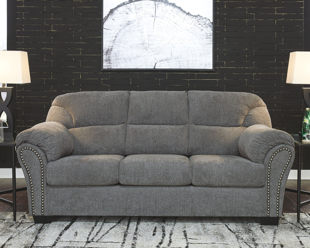 Why sacrifice comfort for style (or style for comfort) when you can have the best of both in this sofa in pewter gray. Elements include a chic divided-back design and pillow top wrapped armrests that make nodding off all too easy. Calling attention to the