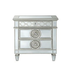 The Varian nightstand provides a commanding presence in any room. Add a dash of glam to your bedroom with this Varian nightstand, it features four tapered legs and 2 storage drawers with crystal-like knobs. This gorgeous nightstand is accented with raised