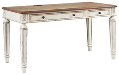 Elevating the art of traditional cottage styling, this desk is your heavenly home office realized. Its antiqued two-tone aesthetic blends a chipped white with a distressed wood tone top for added charm. Framed drawer fronts, decorative corbels and elegant
