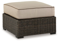 Who says the great outdoors isnâ€™t made for luxury living? This cushioned ottoman offers all the high-end design, plush comfort and durability you could ask for, and then some. Its all-weather, rust-proof aluminum frame provides the easy-breezy wicker lo