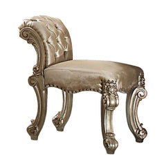 Create an elegant, traditional design in your bedroom with the gold patina and bone Vendome vanity stool. This hand-crafted piece inspired from the luxurious designs of the past, this stool features elaborate wood carving details, traditional hardware and