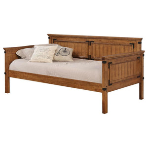 Immerse yourself in the warmth and timeless appeal of classic mission style with this rustic honey-finished daybed. Perfectly suited as an alternative to a sofa, it blends seamlessly into family living spaces or guest rooms. Constructed from solid rubberw
