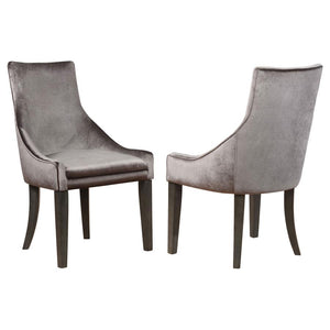 Bring romance and sophisticated style to a transitional space. Elegance abounds in this everyday dining chair that hints at a formal motif. Luscious grey upholstery offers cool tones and a versatile palette. Dark charcoal finish wood legs echo a charming 
