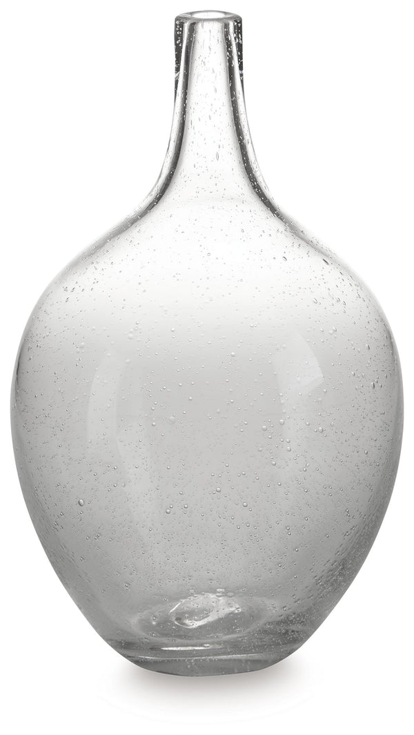 Infuse your shelf, mantel or tabletop with casual charm. Crafted from clear seeded glass, this vase effortlessly captures the essence of weathered beauty. Whether it-'s indoors or outdoors, this vessel is enchantingly simple unadorned or filled with your 