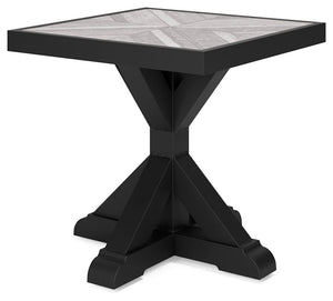 Sporting an easy-on-the-eyes elegance, this end table elevates the art of alfresco living. Beautiful and durable enough for indoor and outdoor use, this high-style/low-maintenance table charms with X-leg farmhouse styling. With a unique reverse diamond ti