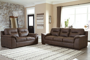 Everyone can have the best seat in the house with this sofa and loveseat. An indulgent choice with deep seats crafted for cloud-like softness, this set is the ideal merger of modern flair and classic staying power. <h4><b>Maderla - Walnut - Sofa</b></h4> 