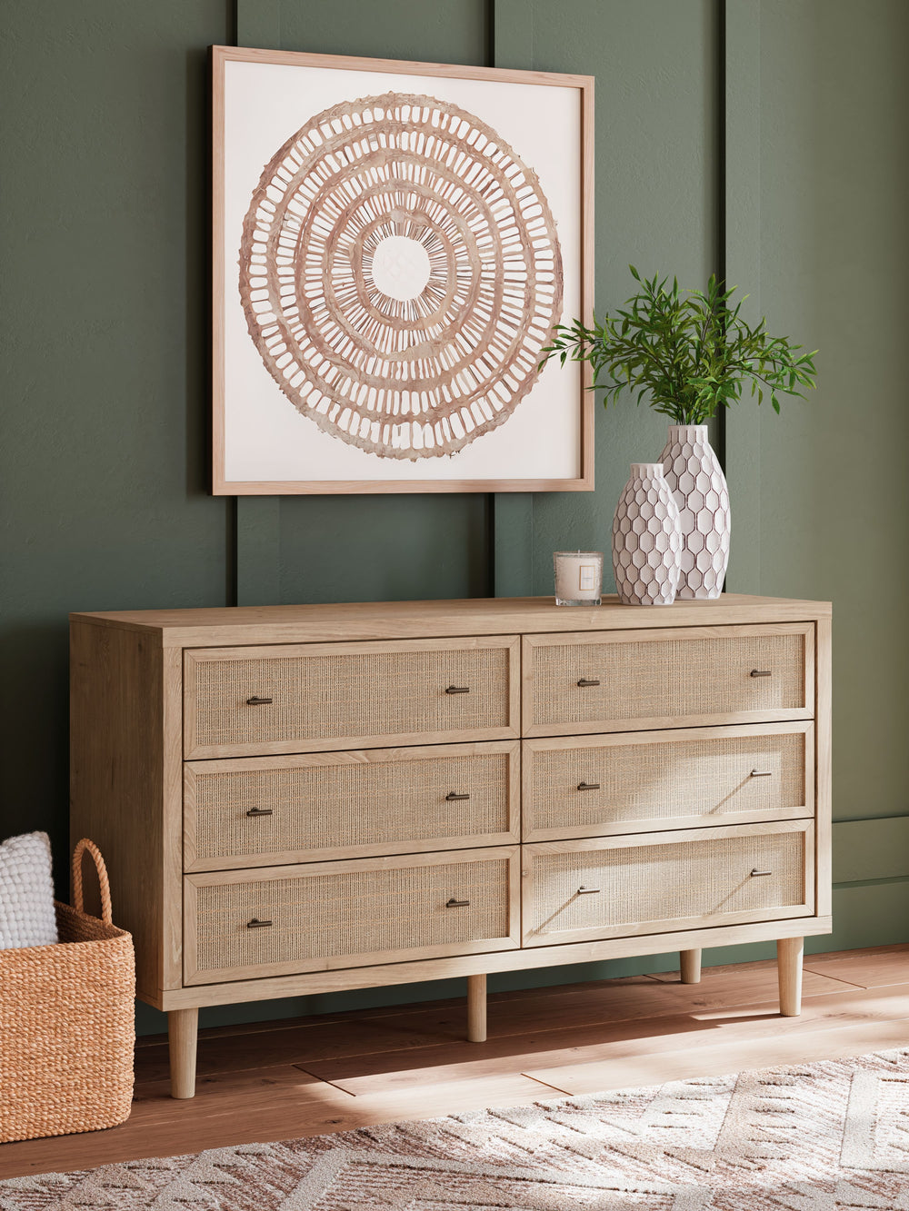 Clean-lined and contemporaryâ€”but far from starkâ€”this dresser is a fresh style awakening. Pairing a light finish with replicated oak grain and textured beige details that replicate the look of cane, its mixed materials bring a naturally versatile vibe 
