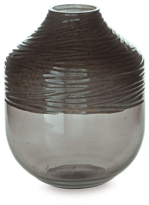 The accent is on contemporary with this exquisite glass vase. Its cool iridescent gray finish and hand-carved pattern deliver a sophisticated statement wherever you like. For those with an artful eye and a love of modern elegance, it-'s a beauty to behold