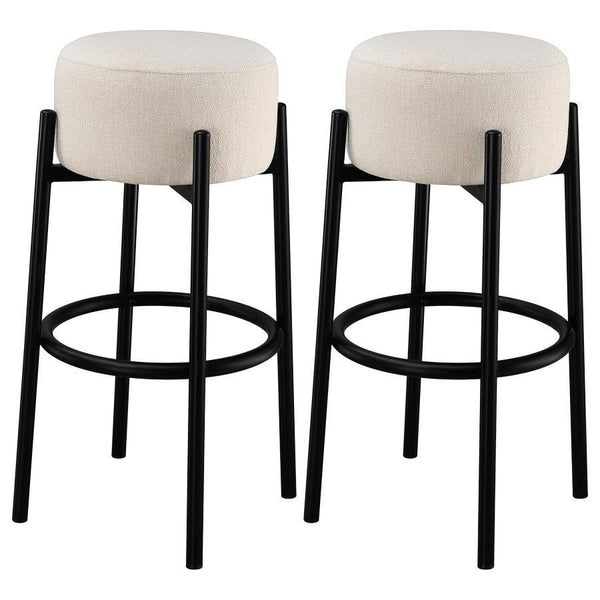 Casual with sleek lines, slide this pair of contemporary stools up to a bar or kitchen breakfast area. Designed with a thick pouf-like cushion wrapped in a white upholstery, this stool lends an elegant playful charm to any space. The pouf-inspired seat re