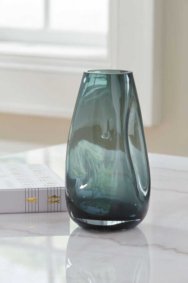  recalling seaside aesthetics with its teal glass. A stunning solo accent