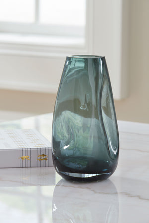  recalling seaside aesthetics with its teal glass. A stunning solo accent