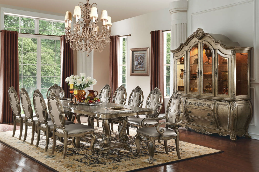 The Ragenardus formal dining collection shows traditional style that is designed to impress. Each piece of this collection demonstrates delicate craftsmanship and intricate carved details. Matching hutch and buffet reflect all carefully selected design th