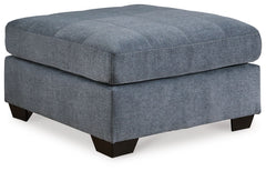 This oversized accent ottoman takes a homey approach to high style. Its denim-inspired fabric has classic versatility, while a contemporary silhouette and stitched details keep the look totally on trend. And you can count on comfortâ€”the ottoman-'s large