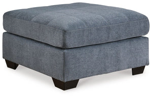 This oversized accent ottoman takes a homey approach to high style. Its denim-inspired fabric has classic versatility, while a contemporary silhouette and stitched details keep the look totally on trend. And you can count on comfortâ€”the ottoman-'s large