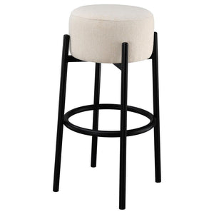  this stool lends an elegant playful charm to any space. The pouf-inspired seat re