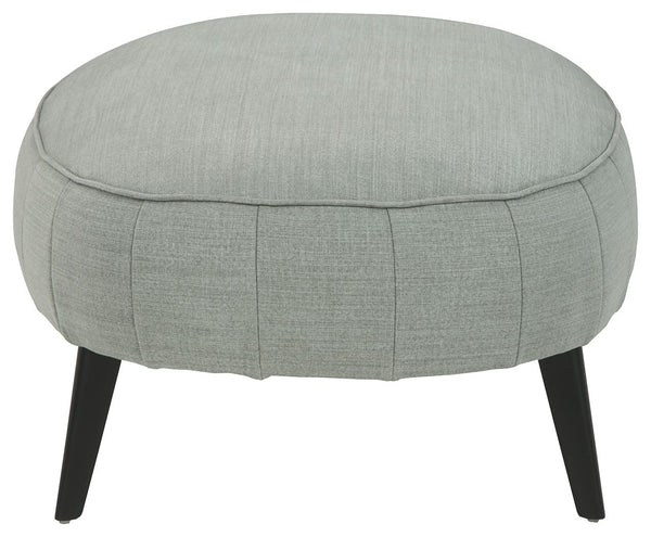  tapered legs. Pop your feet up or use this oversized accent as a center table with a tray placed o
