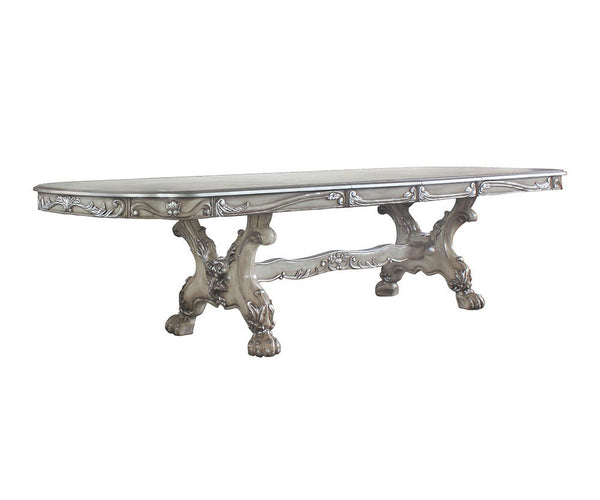  with ornate carvings and raised floral motifs on its apron and trestle base. Two self-stor